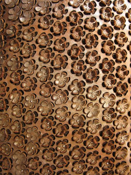 Flower shapes cut by laser, metallic nailheads as decoration. Wool fabric basics