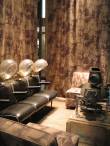 Naked bodies adorn the fabric of a beauty parlor'.