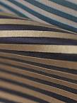 Tari uses a latex glue that is guaranteed not to run to affix narrow bands of dipped entrefino onto a canvas backing.