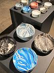 The different colored patterns are determined by how much pigment is added to the casting mix, and how the mix is poured into each individual mold. Each object is a visual frozen moment of the process of making.