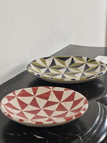 Hannah Watts hand-carves her designs into the ceramics